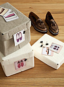 Shoeboxes labelled with clipped-on photos: organisation and storage idea