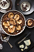 Chocolate clafoutis with pears and gorgonzola, gorgonzola cheese, peaces of chocolate
