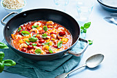 Mediterranean fish and prawn stew with chorizo sausage, cherry tomatoes, basil and paprika