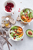 Green salad with oranges, avocado and pomegranate
