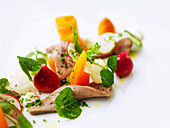 Beef tongue with baby vegetables, radishes and watercress