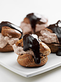 Whole cream puffs with chocolate cream filling