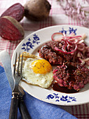 Beetroot cutlets with a fried egg