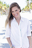 A long-haired woman wearing white shirt