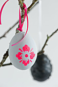 Grey Easter eggs with neon flower motifs