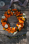 Wreath of pot marigolds and roses