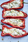 Grilled red pointed peppers filled with feta cheese and rosemary