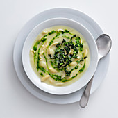 Creamy potato soup with pasta and Tuscan kale pesto