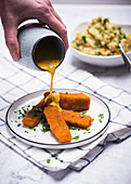 Vegan 'fish fingers' made from soya protein with a creamy herb sauce