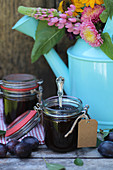 Homemade damson jam in flip-top jars