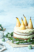 Christmas cake with vanilla frosting and pears