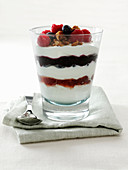 Yogurt Parfait with raspberries and blueberries garnished with candied pecans