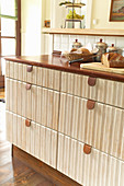 Drawers with leather pulls in rustic fitted kitchen