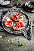 Bruschetta on toast with roasted bell pepper, feta cheese and mint