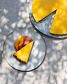 Mango tart with yoghurt cream, a biscuit base and berry sauce