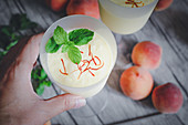 A peach smoothie with saffron and mint
