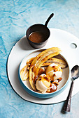 Butterscotch sauce with burnt-butter bananas and vanilla ice cream