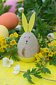 Easter bunny and Easter eggs with cowslip and wood anemone