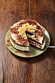 Crispy mascarpone cake decoration with chocolate-coated cornflake clusters