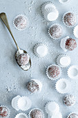 Chocolate truffles rolled in coconut.