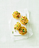 Colourful spaghetti nests with peas, sweetcorn and ham