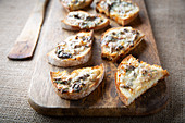 Winter chanterelle mushrooms with cheese, on toast