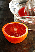Blood orange and juice on dark background