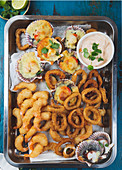 Seafood hot platter - Fried squids rings, Baked ostiones and fried shrimps baked with sauce