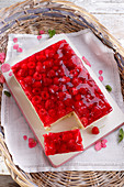 Summer cake with raspberry jelly and fresh raspberries