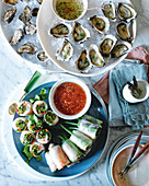 Oysters with ginger vinaigrette and King prawn rice paper rolls