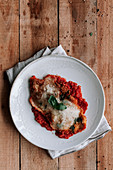 Roasted chicken with Parmesan and leaf of basil