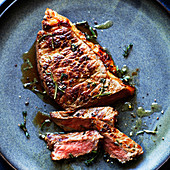 Cut beef steak with herbs