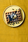 Waffles with salted caramel ice cream and blueberries