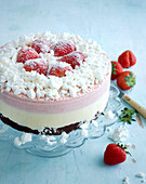 Neapolitan ice cream cake with meringue crumbs and strawberries