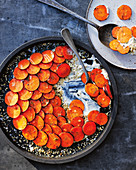 Carrots cooked over coals, labneh and toasted seeds