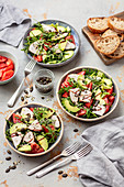Salad with baked turkey, avocado and tomatoes
