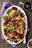 Salad with halloumi cheese, beetroots and dried tomatoes