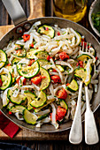 Konji pasta with tomatoes and courgette
