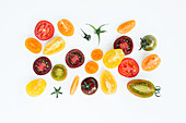 Colourful tomato slices on a white background