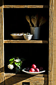 Kitchen storecupboard of fruit and utensils