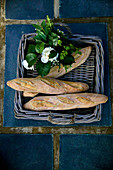 Wicker tray of bread and flowers