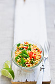 Vegan couscous salad with peppers and sugar snap peas