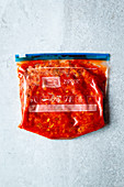 Homemade vegetarian Bolognese sauce in a zip freezer bag
