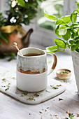 Steaming herbal tea in a cup