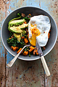 Fried egg with avocado and kale butternut squash hash