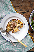 Low carb cauliflower steak with cheese and mushrooms