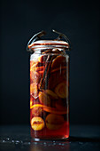 Pickled plums in a jar