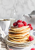 Ricotta pancakes with rasberries, dusted with icing sugar.