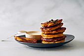 Pumpkin fritters with sage butter and yoghurt