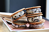 Pile of oversized cookies and cream ice cream sandwiches